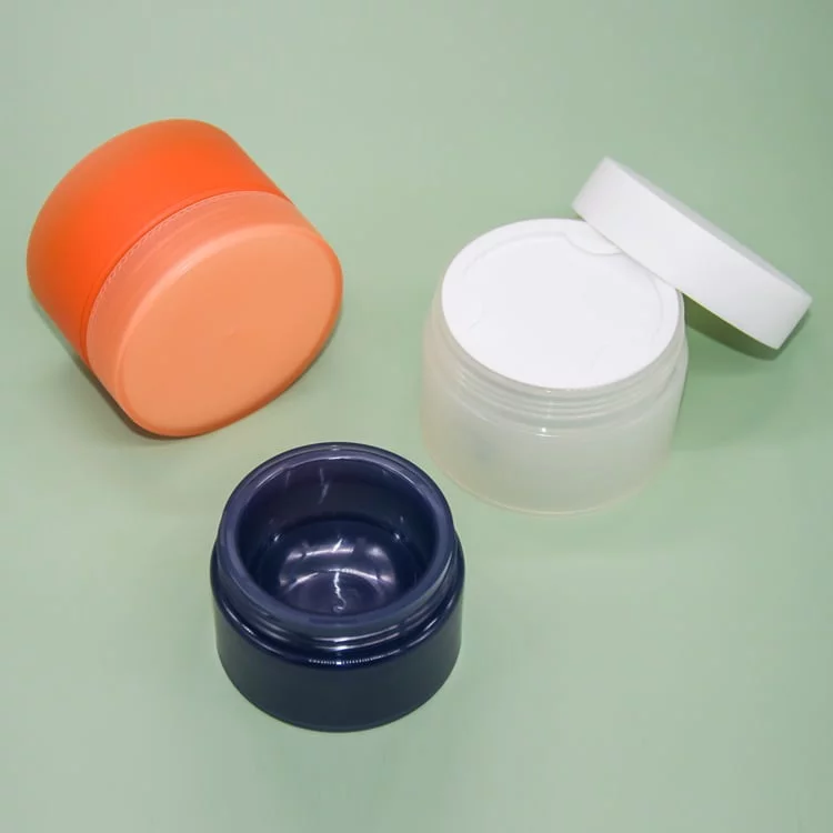 Different colors of the 4 oz cosmetic jars with lids