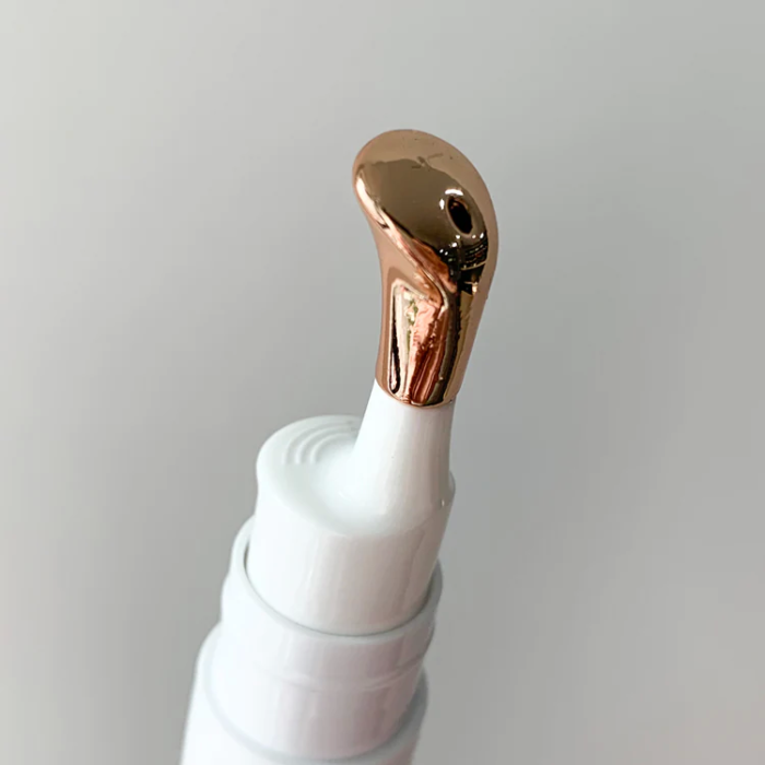 gold metal head of cosmetic eye serum cream bottle