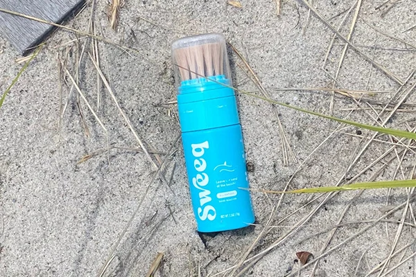 custom squeezable powder brush bottle for sweeq